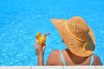 Real female beauty relaxing at swimming pool