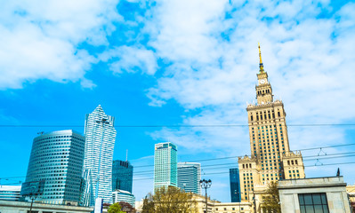 Fototapeta na wymiar Panorama of Warsaw with modern skyscrapers on a sunny day with a blue sky overlooking the Palace of Culture