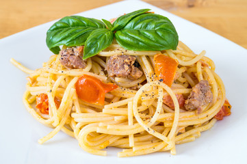 Spaghetti with sausage and cherry tomatoes