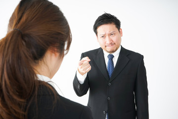 Boss angry with young business person