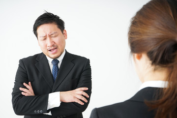 Boss angry with young business person