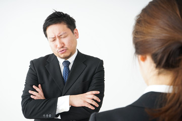 Boss angry with young business person