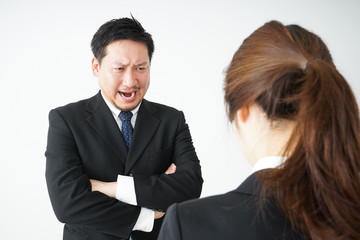 Boss angry with young business person