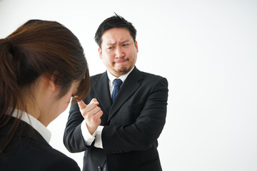Boss angry with young business person