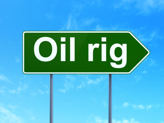 Manufacuring concept: Oil Rig on road sign background