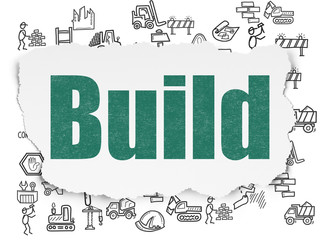 Building construction concept: Build on Torn Paper background