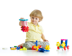 little child with construction set over white background