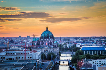 Fototapeta na wymiar Berlin rooftops view with Berlin Cathedral and Spree river at sunset, Germany