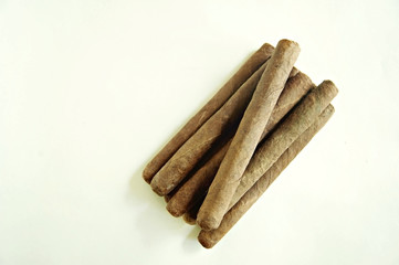 Brown cigar on white background