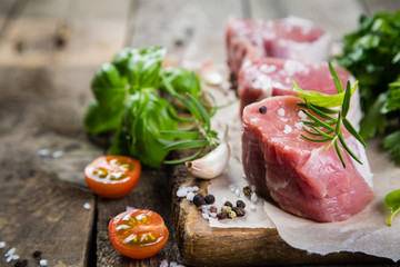 Raw filet mignon meat cuts with spice and herbs