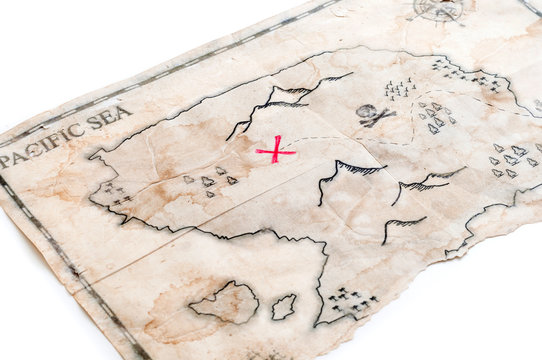 Closeup to fake treasure map with red cross of Pirates Chest