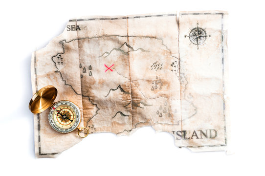 Folded vintage map of fake island with Pirates Treasure chest and compass