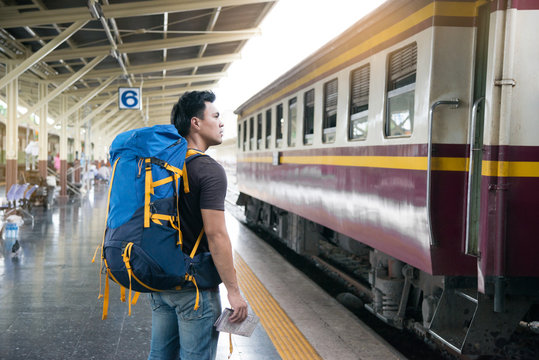 Traveler Wearing Backpack Waitting Railway At Train Station