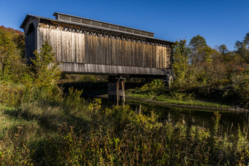 Fototapeta na wymiar Restored Fisher Covered Bridge - Creek - Vermont