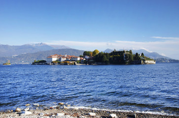 Isola Bella seen from the beach of Stresa town. The island  is divided between the Palace, the Italianate garden, and a small fishing village. Lago Maggiore, Italy, Europe