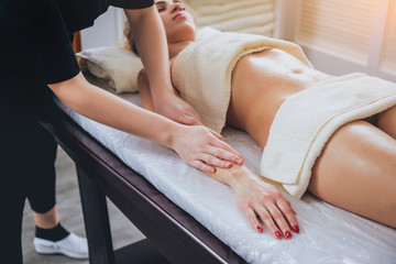 Young girl is relaxing in the spa.