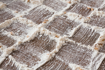 Baking concept on wood background, sprinkled flour with copy space