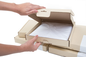 Female hands opening box isolated on white background