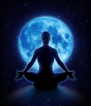 Yoga woman in full blue moon and star. Meditation girl sitting in lotus pose under moonlight in dark night sky, Moon original image from NASA.gov
