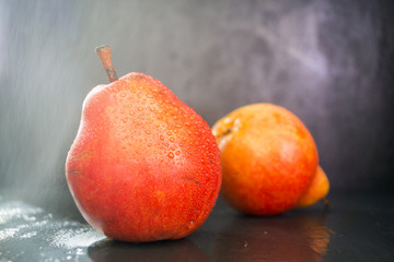 Fresh ripe organic pears on a dark background, VEGA, diet.