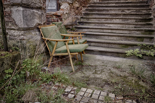 Abandoned chair by the stairs