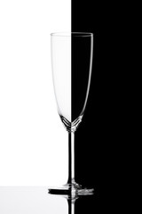 Empty wineglass with reflection.