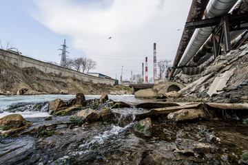 garbage on the bank of the city river