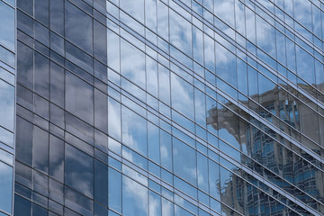Fototapeta na wymiar Blue Glass of Business tall buildings.