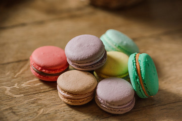 vivid color macaroons on wooden table