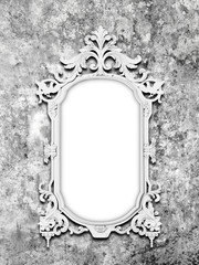 Blank Baroque picture frame on gray concrete wall