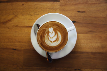 cappuccino coffee on wood background
