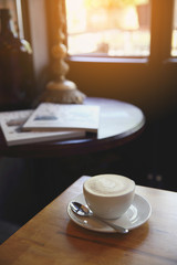 cappuccino coffee on wood background
