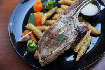 Grilled Porkchop on wood background