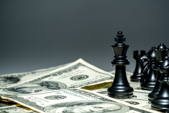King of chess on dollar background.