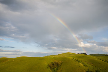 Fototapeta na wymiar Rainbow on the hill