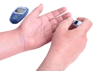 Blood test. Man hands checking blood sugar level by Glucose meter.