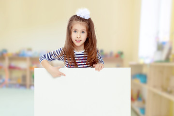 Little girl in a striped dress.