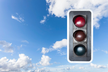  traffic lights, red green and yellow on blue sky background.