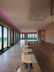 Interiors of a modern apartment, kitchen with sea view