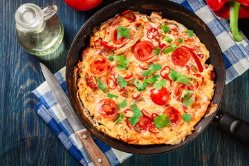 Frittata made of eggs, sausage chorizo, red pepper, green pepper