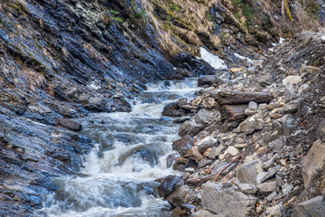 Mountain creek between rocks