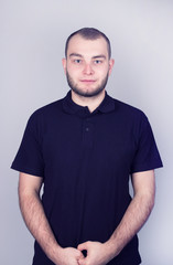Fototapeta premium Portrait of a young bearded man on a white background.