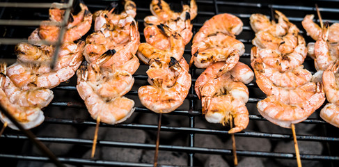 Barbecue grill party. Tasty Fresh food. Shrimps  spit and Beef rolls with bio young spices, chicken strips. bio vegetables