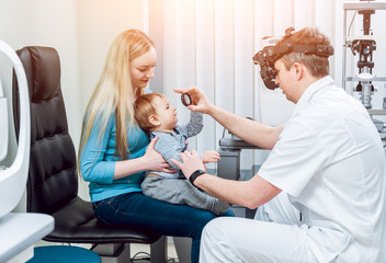 Fototapeta premium Indirect ophthalmoscope. Retinal examination. Fundoscopy. Child vision test.