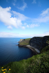 Fototapeta na wymiar Blue skies above the Cliffs of Moher on a sunny day