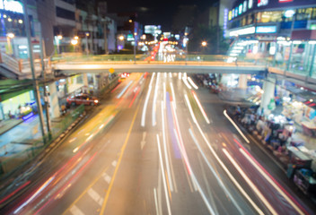 Fototapeta na wymiar Color Blurred background : Bokeh lighting in city night light blur bokeh , defocused background