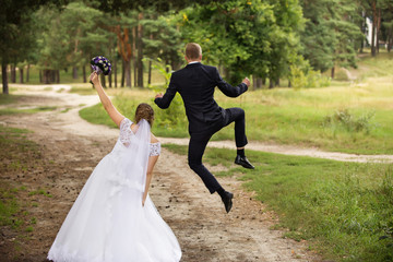 Happy wedding couple, joyful bride and groom