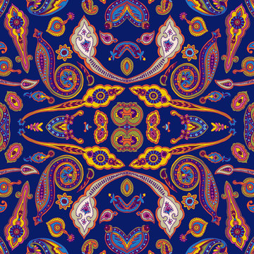 Seamless abstract geometric kaleidoscope paisley pattern. Traditional oriental ethnic ornament, on indigo blue background. Textile design.