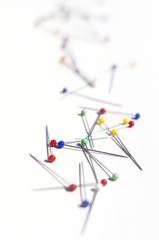 colorful pins on white background - upright format