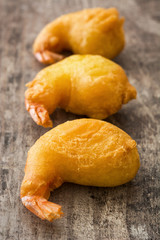 Deep fried shrimps on wooden background

